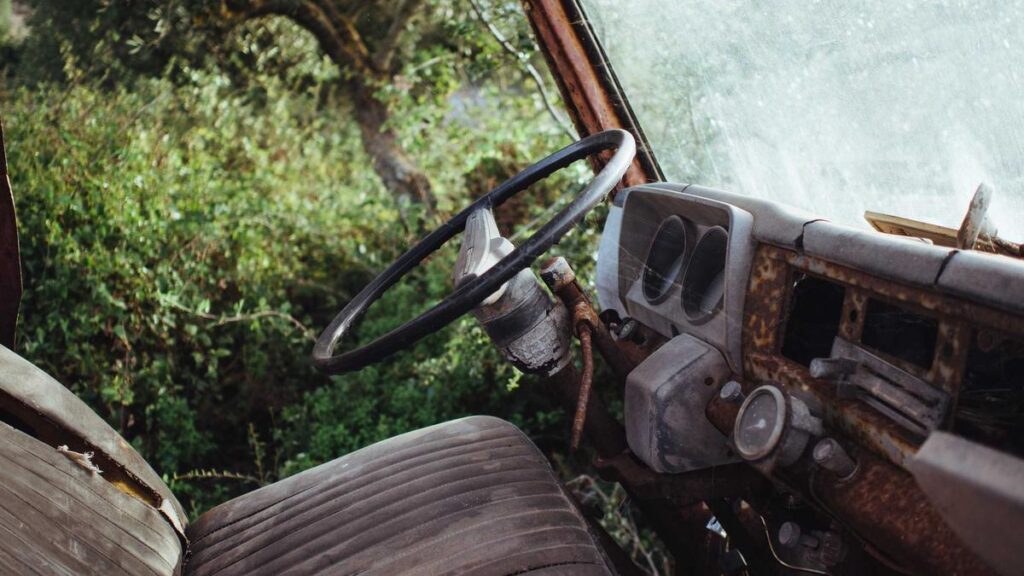Student organizing research notes and source cards beside a laptop